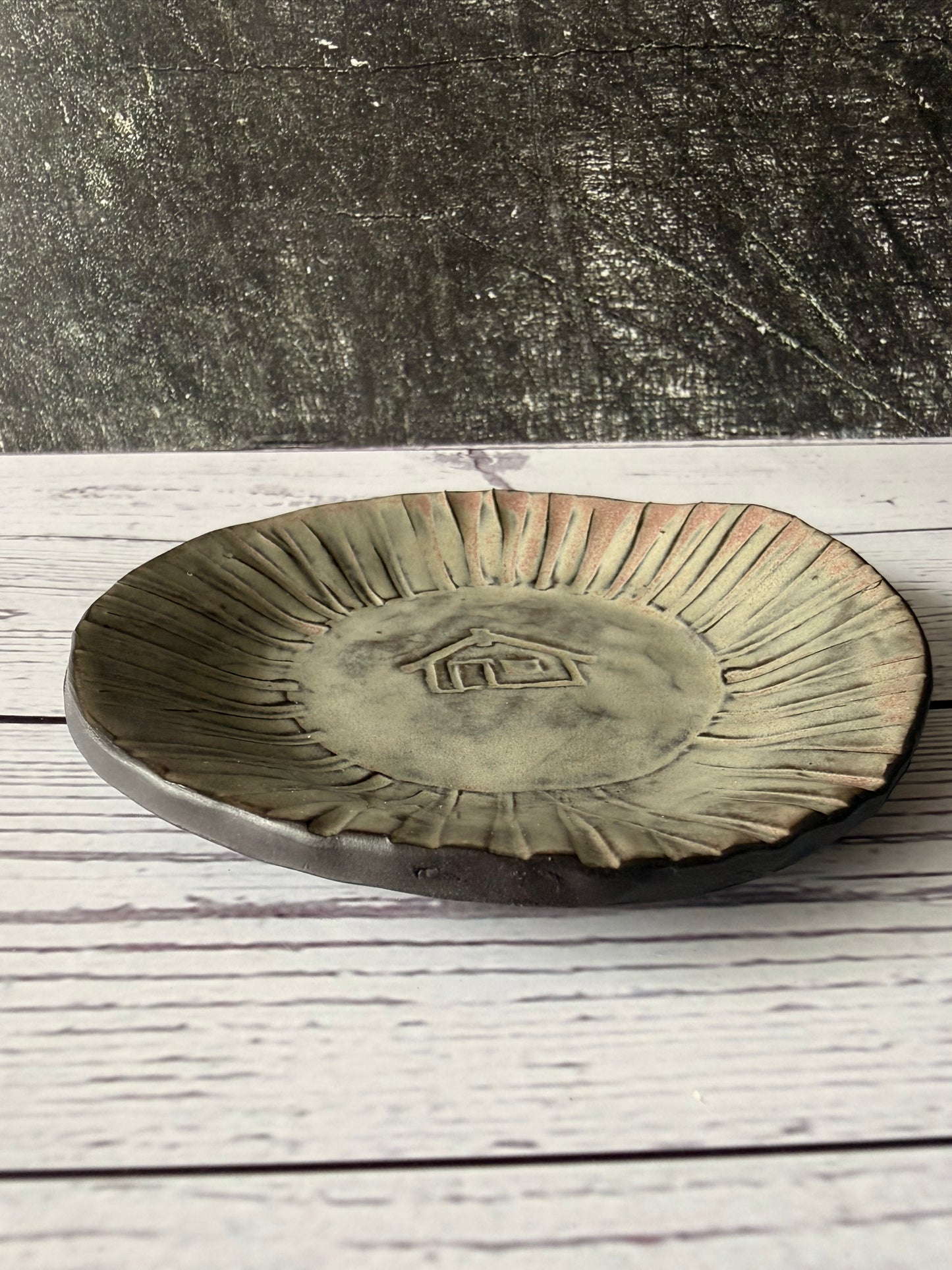 Trinket with wharenui