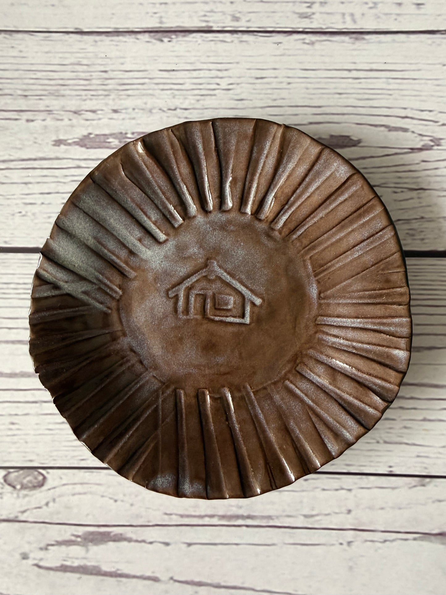 Trinket with wharenui